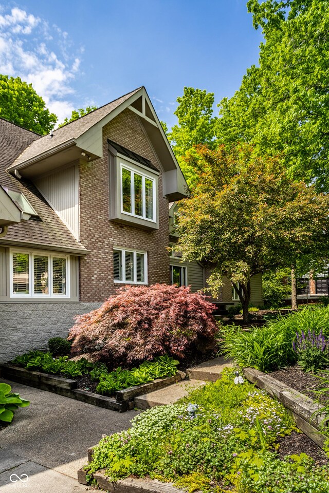 10919 Running Tide Ct, Indianapolis, IN 46236 - view of property exterior with roof with shingles and brick siding