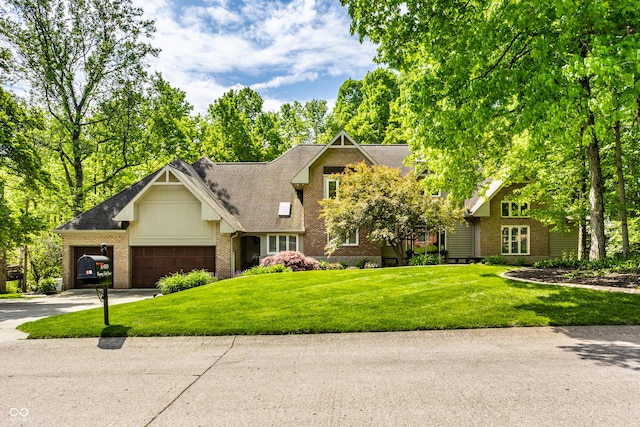 10919 Running Tide Ct, Indianapolis, IN 46236 - craftsman inspired home with brick siding, a garage, a front lawn, and concrete driveway