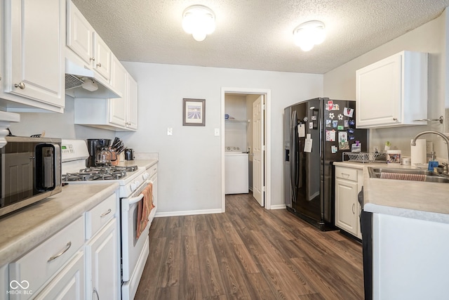 kitchen with white gas range, washer / clothes dryer, a sink, black fridge, and under cabinet range hood
