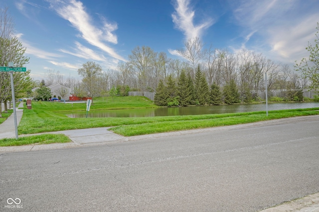view of street with a water view and sidewalks