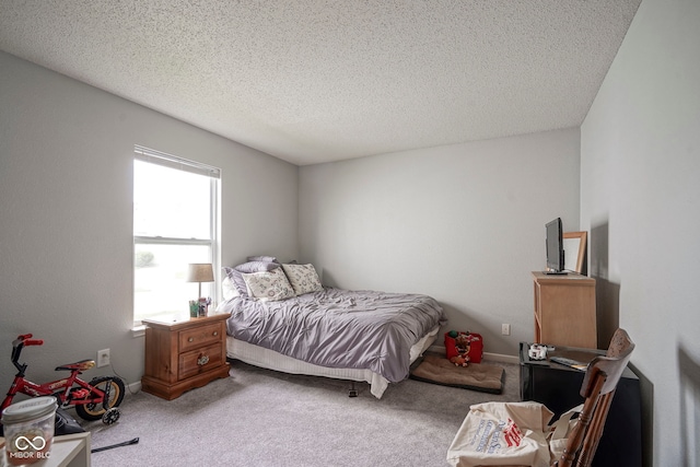 carpeted bedroom with a textured ceiling