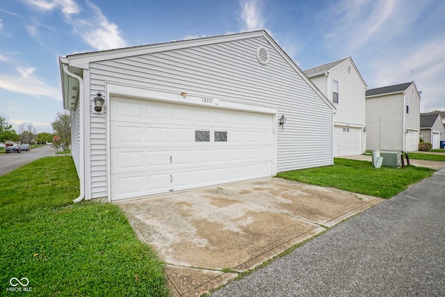 garage with concrete driveway