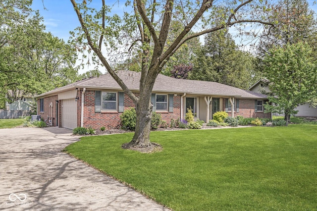 ranch-style house with brick siding, an attached garage, driveway, and a front lawn