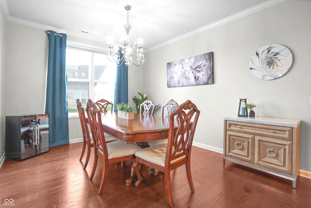dining space featuring baseboards, a chandelier, ornamental molding, and dark wood finished floors