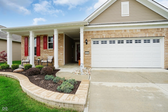 single story home featuring brick siding, a garage, covered porch, and concrete driveway