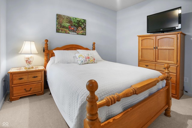 bedroom with light colored carpet