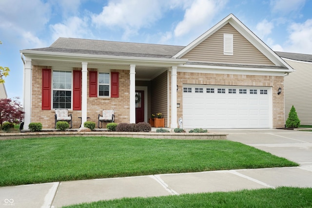 view of front facade featuring an attached garage, a front lawn, brick siding, covered porch, and driveway