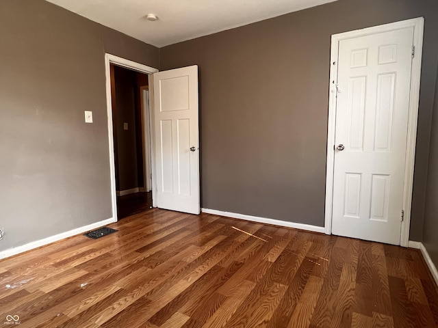 3541 Orchard Ave, Indianapolis, IN 46218 - interior space featuring baseboards, wood finished floors, and visible vents