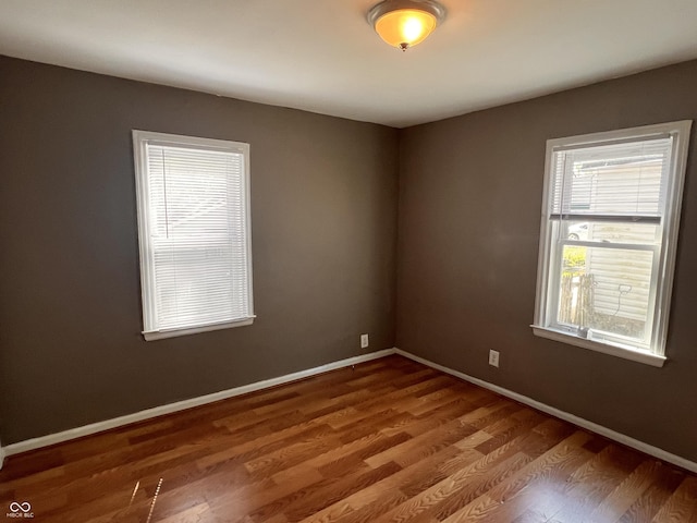 3541 Orchard Ave, Indianapolis, IN 46218 - empty room featuring baseboards and wood finished floors