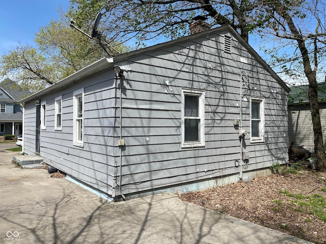 3541 Orchard Ave, Indianapolis, IN 46218 - view of home's exterior featuring a chimney