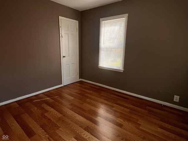 3541 Orchard Ave, Indianapolis, IN 46218 - spare room with baseboards and wood finished floors