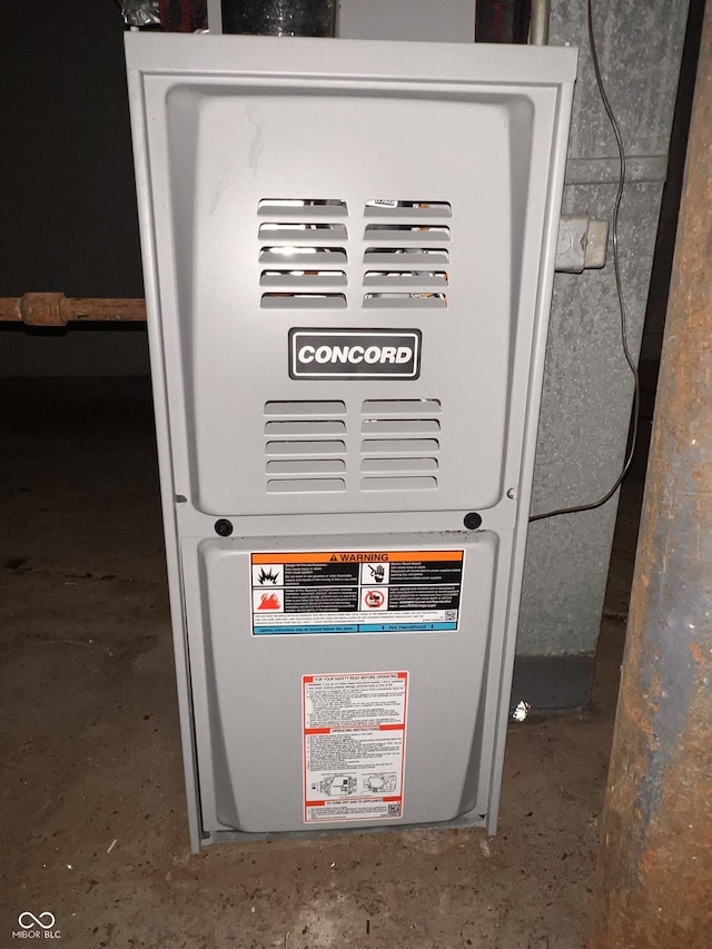 3541 Orchard Ave, Indianapolis, IN 46218 - utility room with heating unit