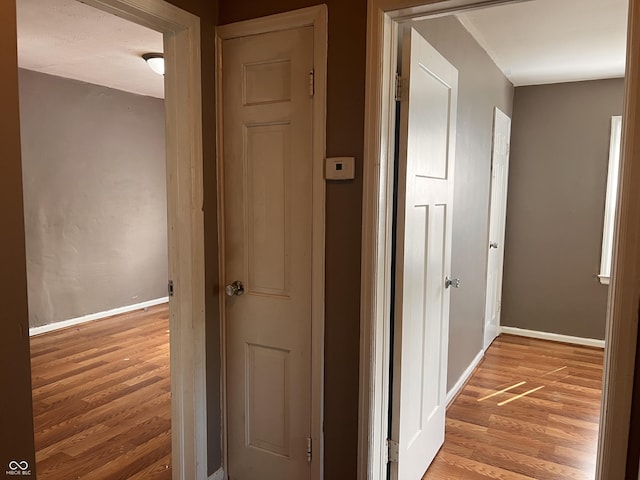 3541 Orchard Ave, Indianapolis, IN 46218 - hall with baseboards and light wood-type flooring