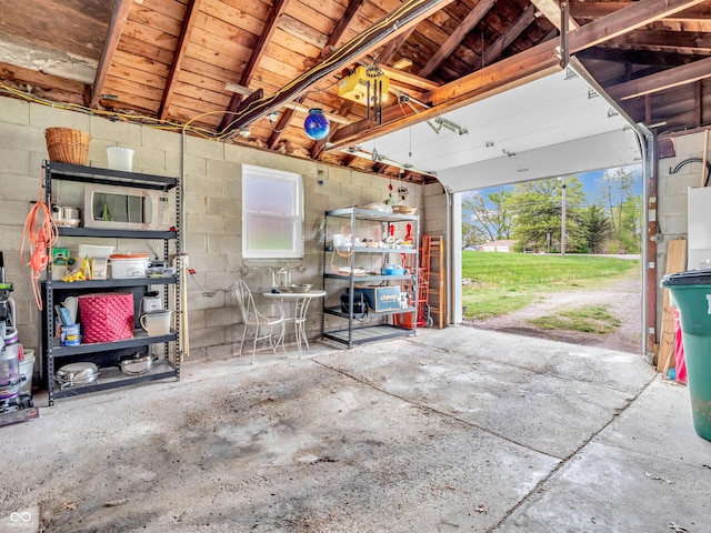 garage with concrete block wall