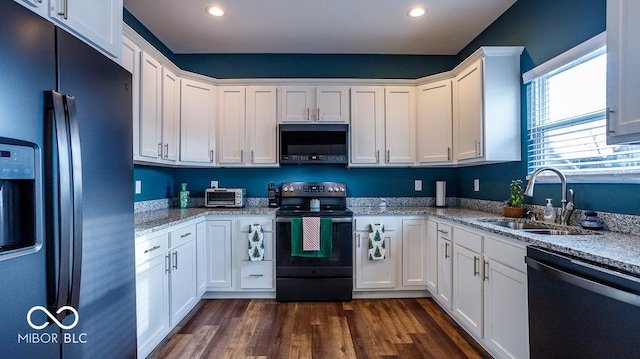 kitchen with a sink, stainless steel refrigerator with ice dispenser, white cabinetry, dishwasher, and black range with electric cooktop