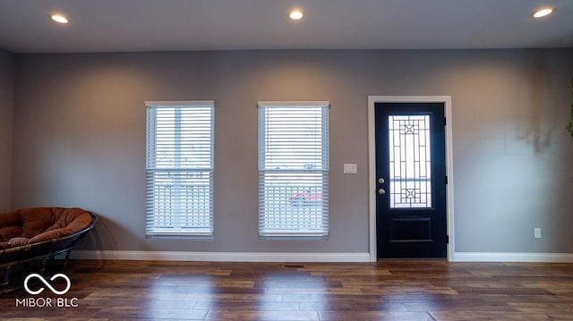 foyer with wood finished floors, recessed lighting, and baseboards