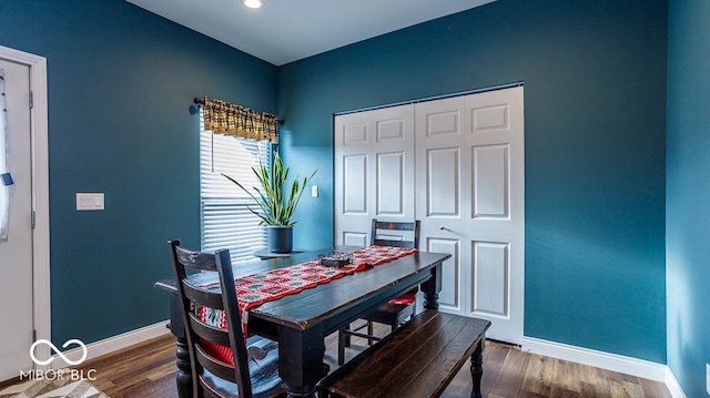 dining room featuring dark wood-style flooring, recessed lighting, and baseboards