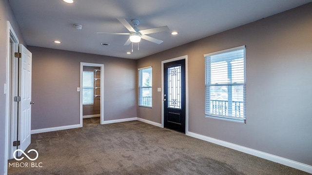 foyer featuring baseboards, recessed lighting, dark carpet, and ceiling fan