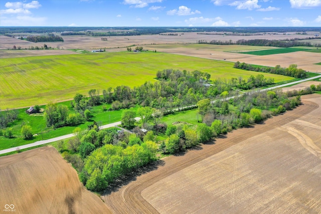 birds eye view of property with a rural view