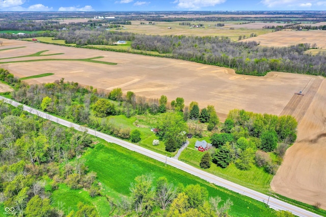 birds eye view of property with a rural view