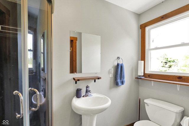 bathroom with toilet and a sink
