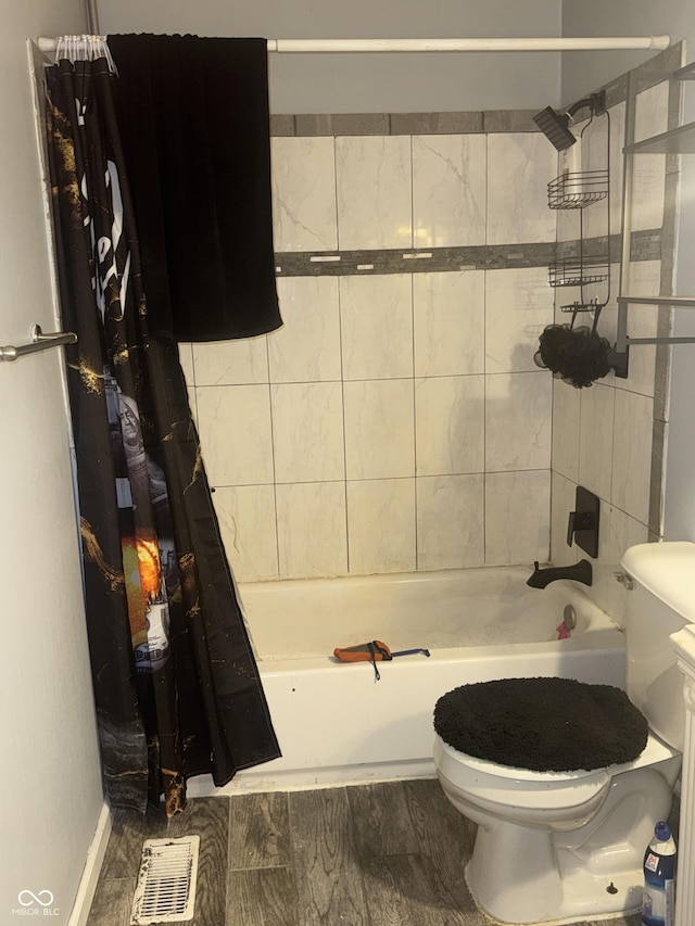 3008 N Michigan Rd, Shelbyville, IN 46176 - bathroom featuring toilet, visible vents, and shower / tub combo