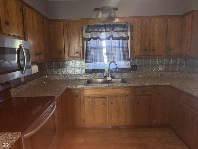 3008 N Michigan Rd, Shelbyville, IN 46176 - kitchen with brown cabinets, appliances with stainless steel finishes, decorative backsplash, and a sink