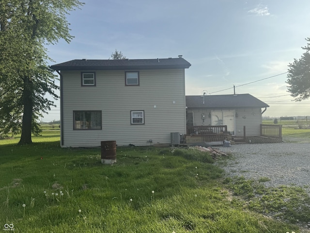 3008 N Michigan Rd, Shelbyville, IN 46176 - back of property with a lawn, a wooden deck, and central AC