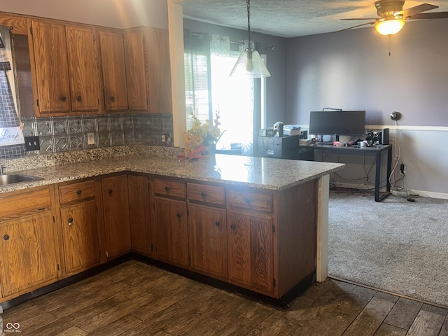 3008 N Michigan Rd, Shelbyville, IN 46176 - kitchen with backsplash, a ceiling fan, brown cabinetry, and a peninsula