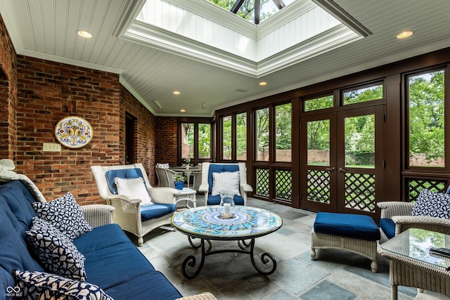 sunroom / solarium featuring french doors and a healthy amount of sunlight