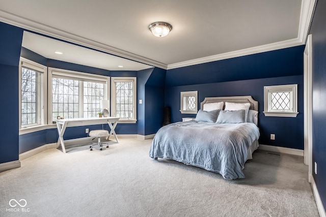 carpeted bedroom with crown molding and baseboards