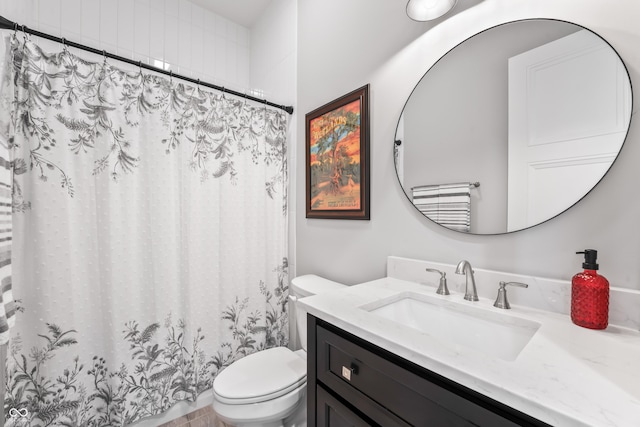 bathroom with vanity, a shower with curtain, and toilet