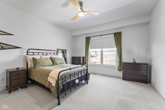 bedroom with baseboards, ceiling fan, and carpet flooring