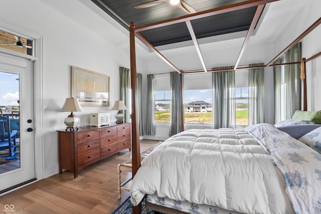 bedroom featuring access to outside and light wood finished floors