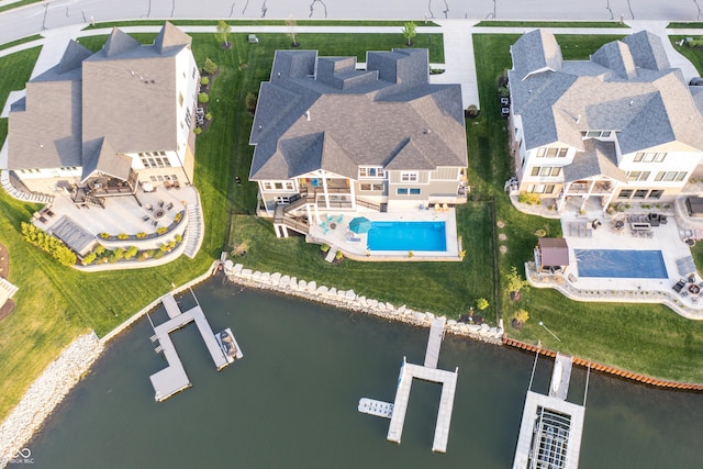 bird's eye view featuring a residential view and a water view