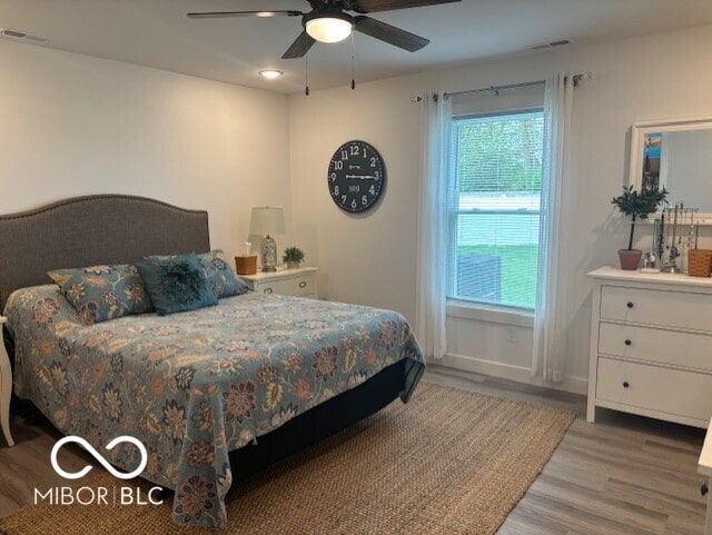 1511 Coen Ct, Columbus, IN 47201 - bedroom featuring wood finished floors, visible vents, ceiling fan, and baseboards