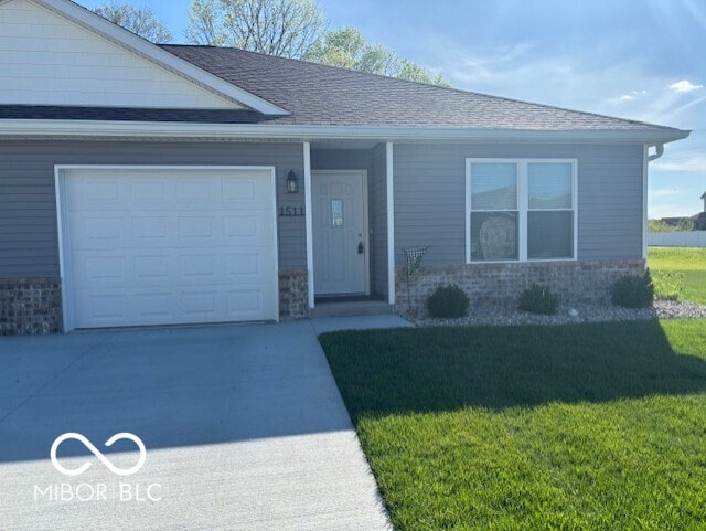 1511 Coen Ct, Columbus, IN 47201 - single story home featuring a front lawn, driveway, and an attached garage