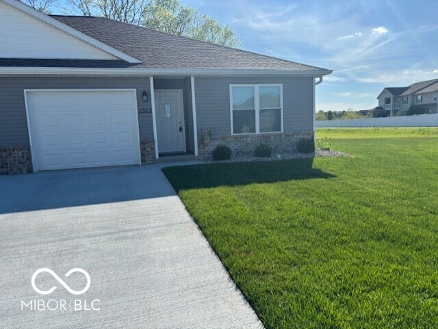 1511 Coen Ct, Columbus, IN 47201 - ranch-style house featuring a front yard, concrete driveway, a garage, and roof with shingles