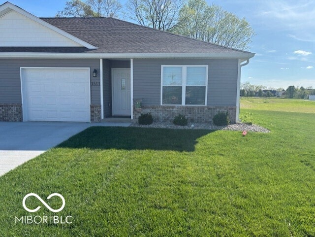 1511 Coen Ct, Columbus, IN 47201 - view of front of home with concrete driveway, stone siding, roof with shingles, an attached garage, and a front lawn