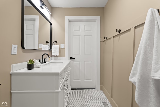 629 N Keystone Ave, Indianapolis, IN 46201 - bathroom with vanity, tile patterned floors, and baseboards