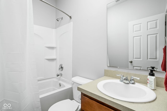 bathroom with vanity, shower / bath combo, and toilet