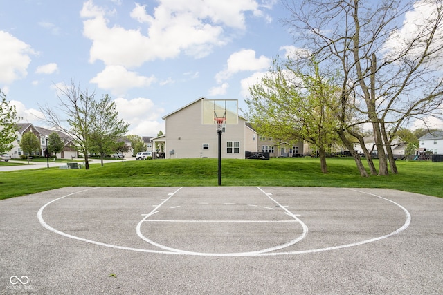 view of sport court with a yard, community basketball court, and a residential view