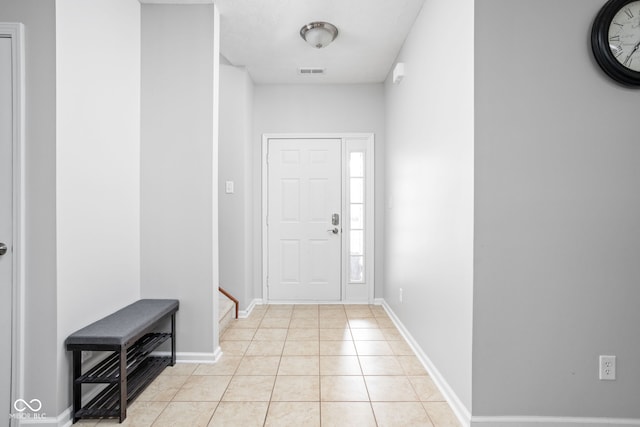 interior space featuring visible vents, baseboards, and light tile patterned floors