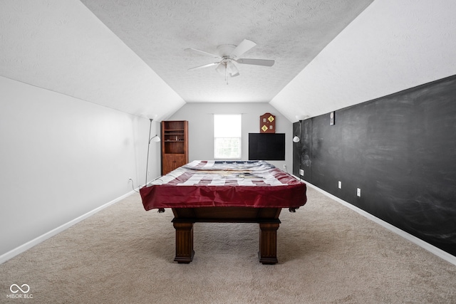 rec room featuring baseboards, a ceiling fan, carpet, and lofted ceiling