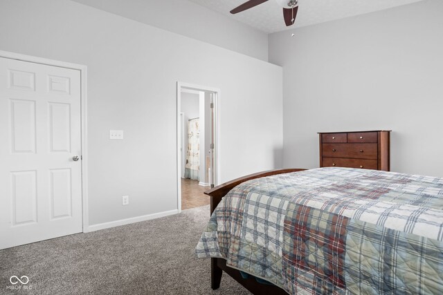 bedroom featuring a ceiling fan, baseboards, lofted ceiling, and carpet
