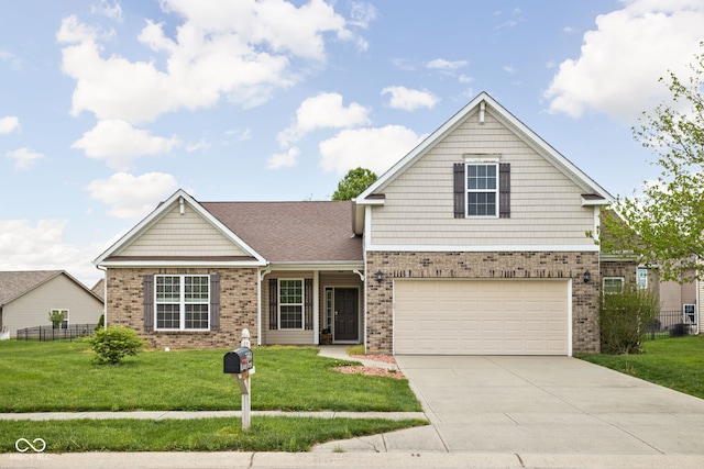 view of front of property with brick siding, fence, driveway, and a front yard