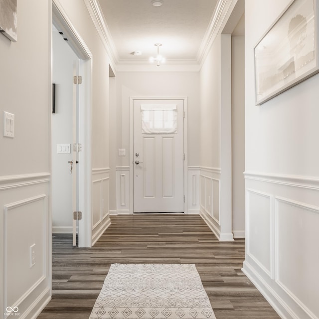 14878 Anees Ln, Fishers, IN 46040 - foyer featuring a decorative wall, dark wood-style floors, crown molding, and a wainscoted wall