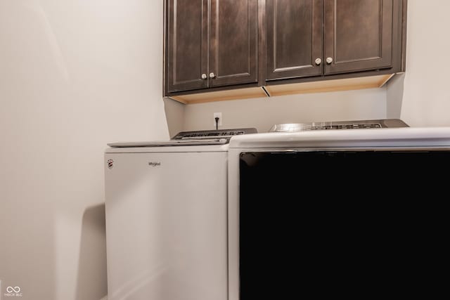 14878 Anees Ln, Fishers, IN 46040 - washroom with cabinet space and washer and clothes dryer