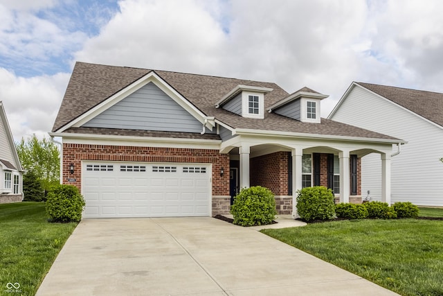 14878 Anees Ln, Fishers, IN 46040 - view of front of house featuring a porch, driveway, roof with shingles, a front lawn, and a garage