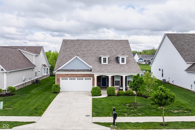 14878 Anees Ln, Fishers, IN 46040 - view of front of house with brick siding, concrete driveway, a garage, a front yard, and central AC unit
